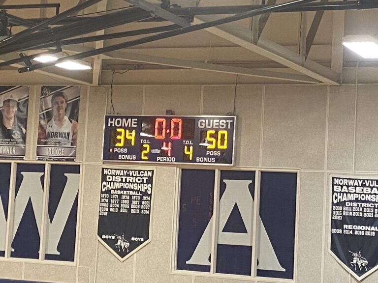 In the season opener, the Munising Mustang boys basketball team defeats the Norway Knights 50-34.